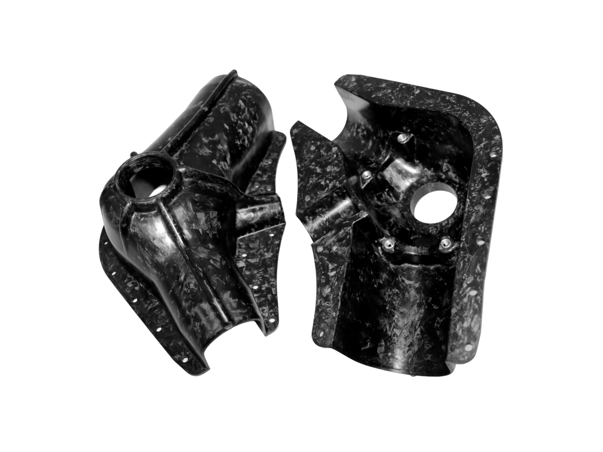 Two black carbon fiber aerospace components with a distinctive marbled pattern, shown on a plain white background.