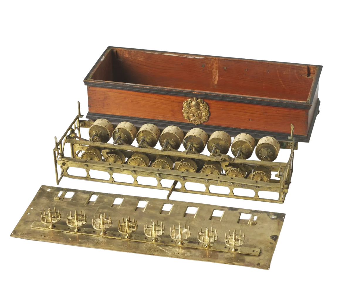An antique mechanical calculator, including a wooden case with brass hardware, a brass roller rack, and a brass dial plate, shown against a plain white background.