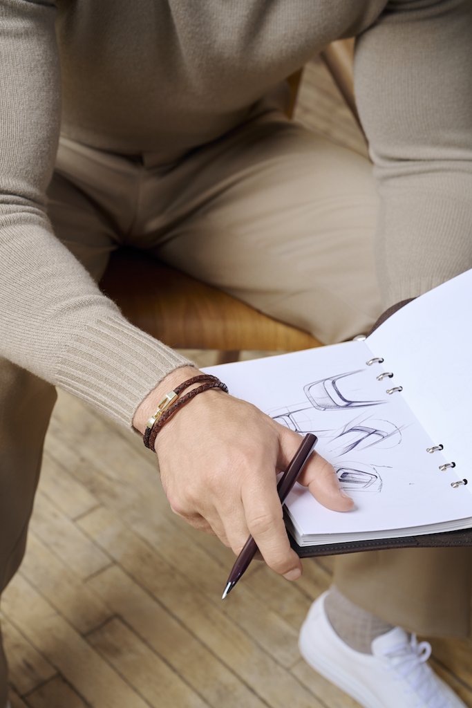 Man with Leather Bracelet Sketching